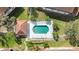 Aerial view of community pool with lounge chairs and well-manicured landscaping at 7254 Cedar Hollow Cir, Bradenton, FL 34203