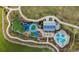 Aerial view of community amenities including playground and clubhouse at 8018 Sandstar Way, Sarasota, FL 34240