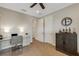 Home office with built-ins and adjacent hallway at 8018 Sandstar Way, Sarasota, FL 34240