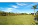 Large grassy backyard with preserve area views at 8066 Redonda Loop, Bradenton, FL 34202