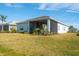 Spacious backyard with screened patio and lush landscaping at 8066 Redonda Loop, Bradenton, FL 34202