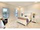 Comfortable bedroom with a queen-size bed and plenty of natural light at 8066 Redonda Loop, Bradenton, FL 34202