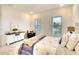 Bright bedroom with comfy bed, white dresser, and large windows at 8066 Redonda Loop, Bradenton, FL 34202