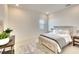 Spacious bedroom with a queen-size bed, light walls, and wood flooring at 8066 Redonda Loop, Bradenton, FL 34202