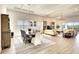 Spacious dining area with large wooden table and access to living room at 8066 Redonda Loop, Bradenton, FL 34202