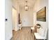 Bright and airy entryway with light wood flooring and white accents at 8066 Redonda Loop, Bradenton, FL 34202