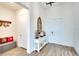 Spacious entryway with white walls, wood-look tile floor, and console table at 8066 Redonda Loop, Bradenton, FL 34202