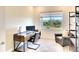 Bright home office features built-in shelving and a comfortable seating area at 8066 Redonda Loop, Bradenton, FL 34202