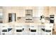 Modern kitchen featuring white cabinets, quartz countertops, and an island with seating at 8066 Redonda Loop, Bradenton, FL 34202