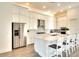 Spacious kitchen with white cabinets, quartz countertops, and stainless steel appliances at 8066 Redonda Loop, Bradenton, FL 34202