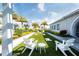 Community lawn with cornhole and comfortable seating at 8066 Redonda Loop, Bradenton, FL 34202