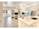 Open living room and kitchen area with high ceilings and tile floors at 8066 Redonda Loop, Bradenton, FL 34202
