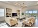 Open concept living space featuring a large sectional sofa and built-in shelving at 8066 Redonda Loop, Bradenton, FL 34202