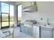 Stainless steel appliances and granite countertops highlight this outdoor kitchen at 8066 Redonda Loop, Bradenton, FL 34202
