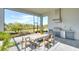 Outdoor kitchen with stainless steel appliances and screened-in patio at 8066 Redonda Loop, Bradenton, FL 34202