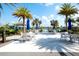 Enjoy the resort-style pool area with tables and umbrellas at 8066 Redonda Loop, Bradenton, FL 34202