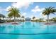 Community pool with a large deck and plenty of lounge chairs at 8066 Redonda Loop, Bradenton, FL 34202
