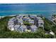 Community of light blue townhomes near the water at 821 Evergreen Way, Longboat Key, FL 34228