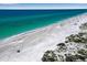 Beachfront property with white sand and clear water at 821 Evergreen Way, Longboat Key, FL 34228
