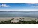 Stunning aerial view of waterfront property with beach access at 821 Evergreen Way, Longboat Key, FL 34228