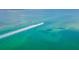 Boat cruising on calm, clear water at 821 Evergreen Way, Longboat Key, FL 34228