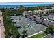 Aerial view of tennis courts and oceanfront community at 821 Evergreen Way, Longboat Key, FL 34228