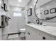 Modern bathroom with white vanity and walk-in shower at 821 Evergreen Way, Longboat Key, FL 34228