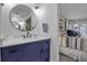 Modern bathroom with navy vanity and walk-in shower at 821 Evergreen Way, Longboat Key, FL 34228
