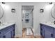 Double vanity bathroom with large shower and updated fixtures at 821 Evergreen Way, Longboat Key, FL 34228