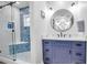 Spa-like bathroom with walk-in shower and blue tile at 821 Evergreen Way, Longboat Key, FL 34228