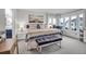 Main bedroom with king bed, ample natural light, and ensuite bathroom access at 821 Evergreen Way, Longboat Key, FL 34228