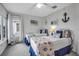 Guest bedroom with twin beds and nautical themed decor at 821 Evergreen Way, Longboat Key, FL 34228