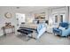 Bright bedroom with comfortable king-size bed and en-suite bathroom at 821 Evergreen Way, Longboat Key, FL 34228
