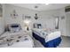 Guest bedroom with twin beds and nautical decor at 821 Evergreen Way, Longboat Key, FL 34228