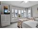 Bright bedroom with twin beds, water views, and coastal decor at 821 Evergreen Way, Longboat Key, FL 34228
