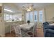 Casual dining area with white table and chairs near kitchen and living room at 821 Evergreen Way, Longboat Key, FL 34228