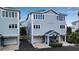 Two-story house with light gray siding and a two-car garage at 821 Evergreen Way, Longboat Key, FL 34228