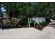 Sign indicating direction to the fishing dock at 821 Evergreen Way, Longboat Key, FL 34228