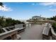 Wooden pier with benches overlooking the water at 821 Evergreen Way, Longboat Key, FL 34228