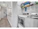 Convenient laundry room with washer, dryer, and storage shelving at 821 Evergreen Way, Longboat Key, FL 34228