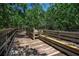 Wooden boardwalk with bench offers scenic mangrove views at 821 Evergreen Way, Longboat Key, FL 34228