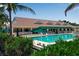 Resort-style pool with lounge chairs at 821 Evergreen Way, Longboat Key, FL 34228