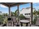 Relaxing screened porch with outdoor seating at 821 Evergreen Way, Longboat Key, FL 34228