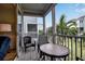 Screened porch with patio furniture and water views at 821 Evergreen Way, Longboat Key, FL 34228