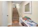 Staircase with a console table and mirror in the entryway at 821 Evergreen Way, Longboat Key, FL 34228