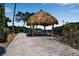 Seaside thatched palapa offering scenic views at 821 Evergreen Way, Longboat Key, FL 34228