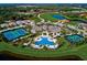 Aerial view of community amenities including pools, tennis courts, and clubhouse at 8612 Sundance Loop, Sarasota, FL 34238