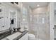 Bathroom with walk-in shower and granite countertop at 8612 Sundance Loop, Sarasota, FL 34238