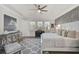 Spacious main bedroom with large windows and a sitting area at 8612 Sundance Loop, Sarasota, FL 34238