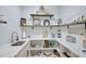 Well-equipped butler's pantry with ample shelving and quartz countertops at 8612 Sundance Loop, Sarasota, FL 34238